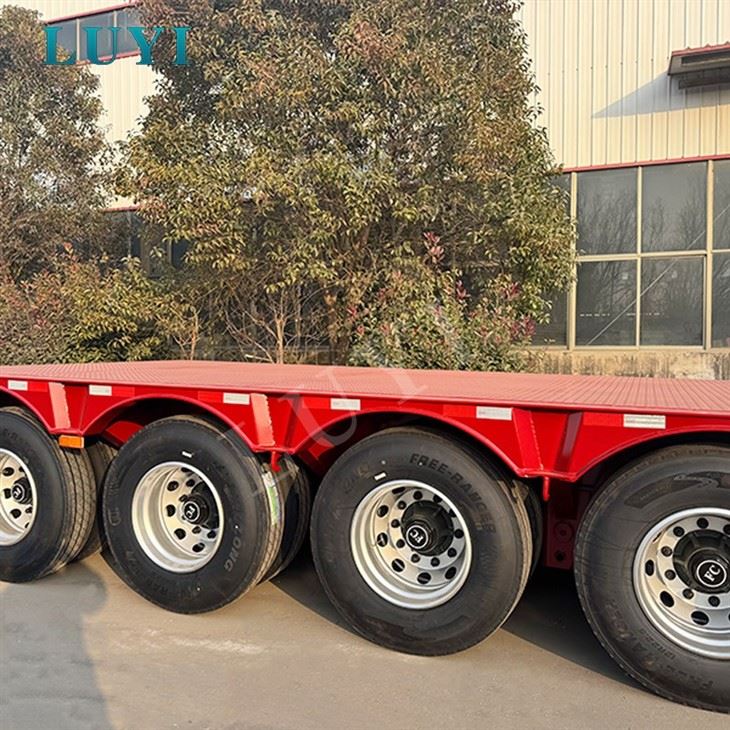4 Axle 80 Tons Heavy Duty Steel Low Bed Flatbed Semi Truck Trailers manufacturers